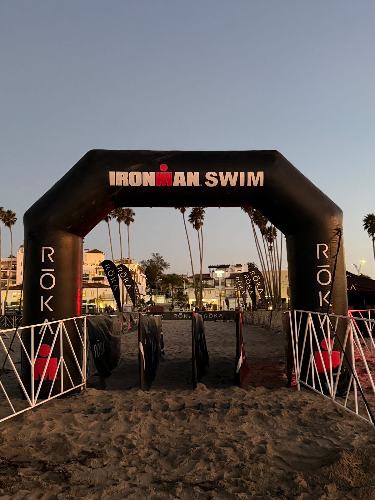 IRONMAN swim start arch on Santa Cruz beach at dawn