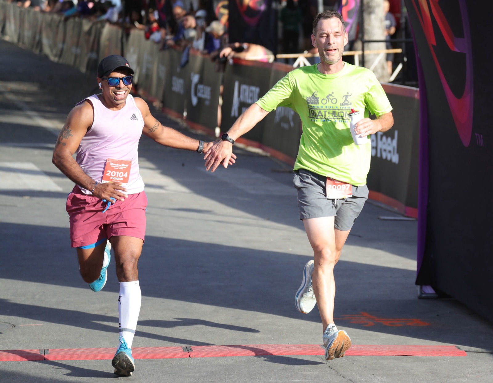Rock 'n' Roll San Jose 10K 2026 — high-five at the finish line